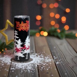 Holiday tumbler with ‘Believe in the Magic’ and festive winter scene design
