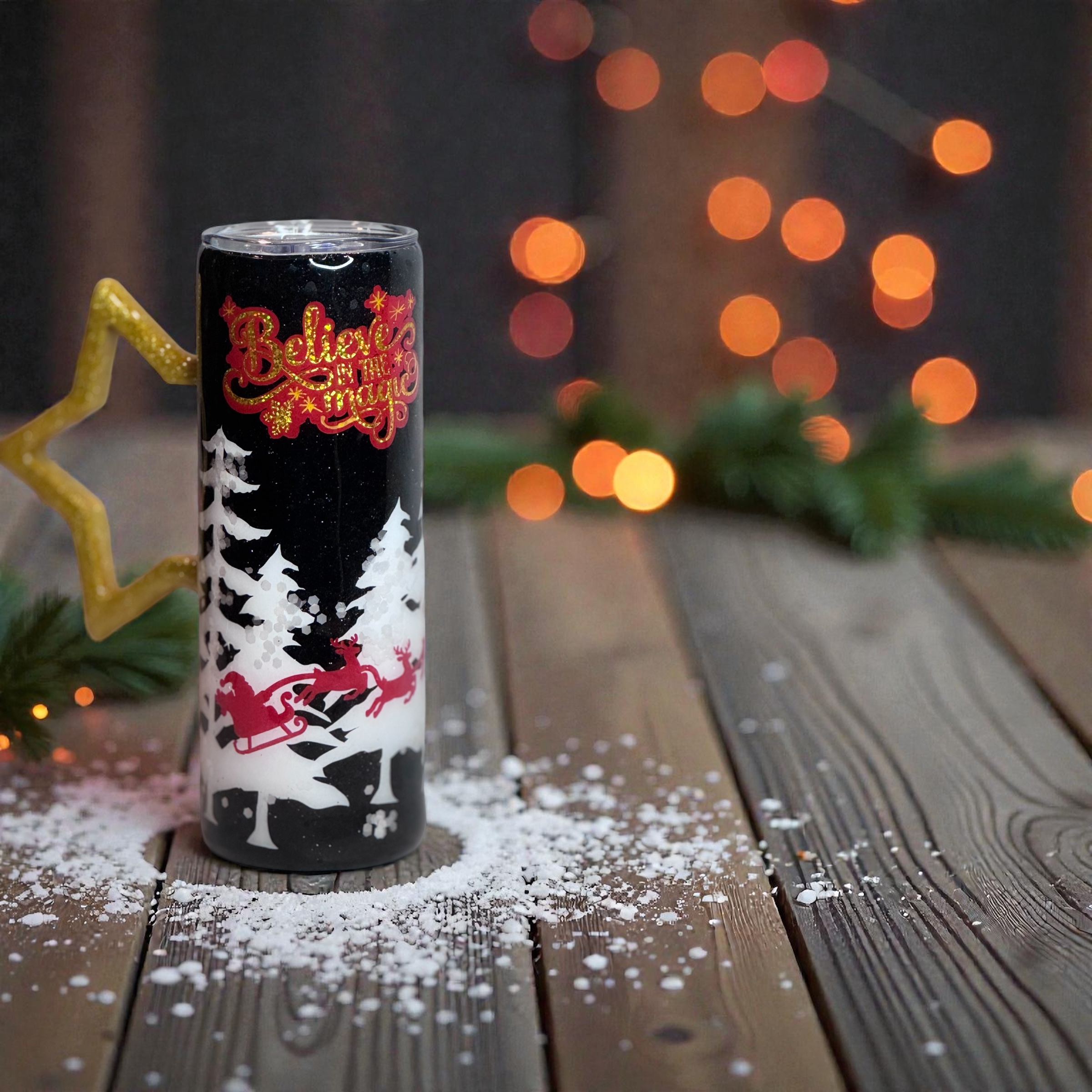 Holiday tumbler with ‘Believe in the Magic’ and festive winter scene design